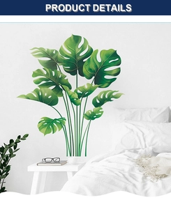 Detail view of tropical Monstera leaf wall stickers in a minimalist white bedroom setting