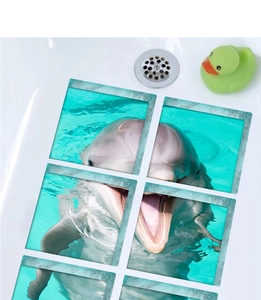 Detailed view of 6-piece 3D dolphin bathtub stickers with non-slip texture in tub