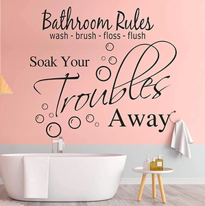 Detail showing Bathroom Rules wall decal with Soak Your Troubles Away text on a split-tone wall