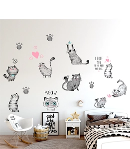 Detail of cute hand-drawn cartoon cat wall stickers with meow quotes for nursery decor
