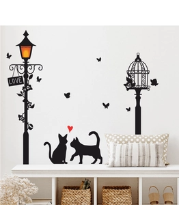 Detail of creative black cat silhouette wall stickers with vintage street lamp and LOVE sign