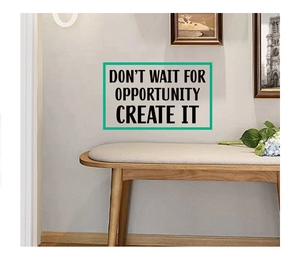 Close-up of inspirational wall decal quote 'Don't wait for opportunity create it' in room