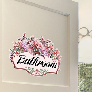 Floral bathroom wall sticker featuring pink roses and elegant cursive lettering on a door