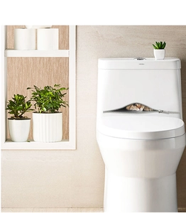 Detail of 3D cat zipper wall sticker applied on a white ceramic toilet tank surface