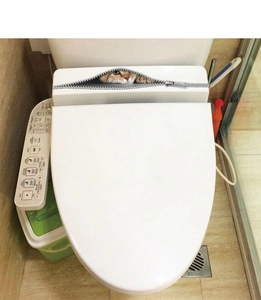 Detail of 3D zipper cat toilet sticker showing realistic calico cat on white surface