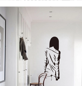 Detail of minimalist black vinyl wall decal featuring an artistic woman silhouette