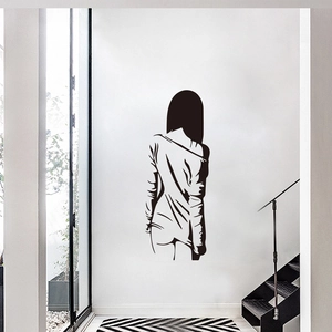 Minimalist woman silhouette wall decal on white living room wall for modern home decor