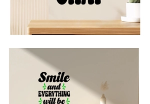 Detail showing 'Smile and EVERYTHING' wall decal with green accents on beige wall