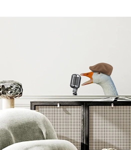 Funny cartoon white goose with brown cap singing into a vintage microphone wall sticker