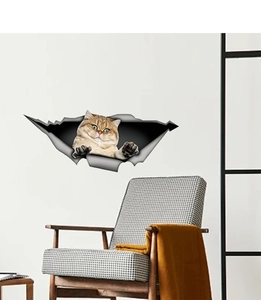 Detail of 3D orange cat wall sticker showing realistic peeking effect on room wall