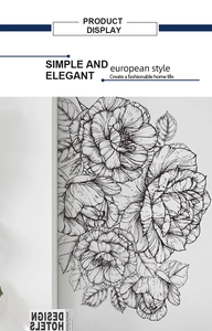 Detail showing elegant black and white floral wall decal in a minimalist living room decor