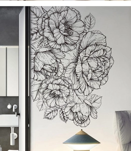 Detail of elegant black and white hand-drawn peony wall stickers on a light room wall