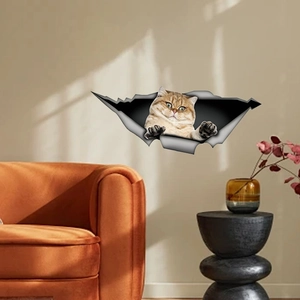 3D cat wall sticker with vivid orange tabby cat peeking through a cracked wall effect