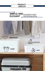 Detailed view of white minimalist storage boxes for wardrobe clothing organization