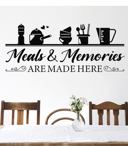 Detail of kitchen wall decal showing Meals & Memories text and cooking utensil silhouettes