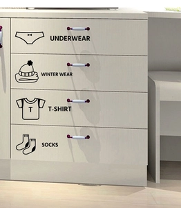 Detail view of closet organization labels for underwear, winter wear, t-shirts, and socks