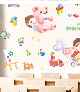 Detail view of cartoon wall stickers with kids, train and alphabet for classroom decor