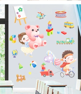 Detail of cartoon wall stickers showing children, vehicles and colorful ABC blocks