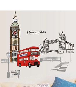 Detail view of London city wall stickers featuring red bus and Big Ben over a modern sofa