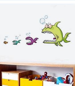 Detailed view of colorful cartoon fish wall stickers with bubbles on a white room wall
