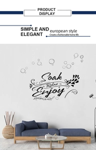 Wall decal detail showing Soak Relax Enjoy typography with bubble patterns for home decor