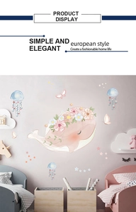 Close-up of pink watercolor whale and blue jellyfish wall stickers for kids bedroom