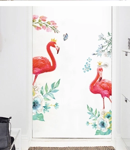 Detail view of flamingo wall stickers with floral patterns on a white indoor door