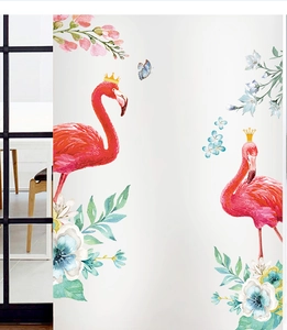 Close-up of watercolor flamingo wall decals with floral patterns and golden crown