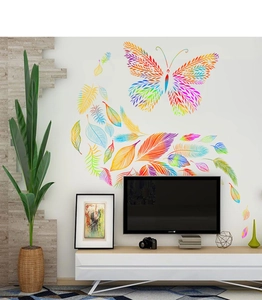 Rainbow butterfly and leaf feather wall stickers shown on a white living room wall decor