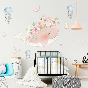 Pink whale wall sticker with floral wreath and colorful jellyfish for nursery room decor