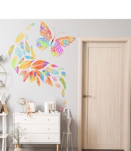 Detail view of colorful gradient butterfly and feather wall stickers in a living room