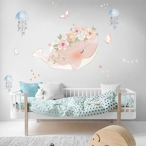 Pink whale wall stickers with flowers and jellyfish for kids room decor in cartoon style