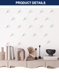 Modern bohemian dandelion wall decals on white wall above a minimalist wooden cabinet