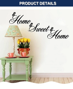 Detail view of Home Sweet Home wall decal with butterfly accents in a cozy living room setting
