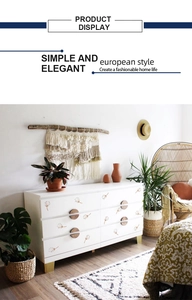 Detail of bohemian dandelion wall stickers applied on white wooden furniture drawer