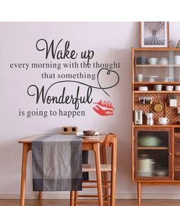 Detail of Wake Up Wonderful inspirational wall sticker with red lip motif in a modern kitchen