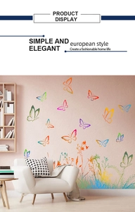 Detail view of colorful butterfly and plant wall decals in a modern living room setting