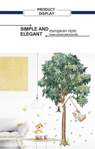 Detailed wall sticker layout featuring cartoon cats playing on a lush green tree decoration