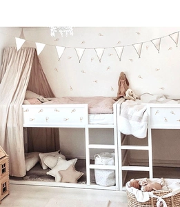 Detail view of dandelion wall stickers applied to a children loft bed in a cozy room