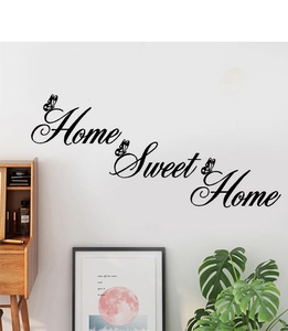 Detail of Home Sweet Home wall sticker with butterfly silhouettes on white living room wall