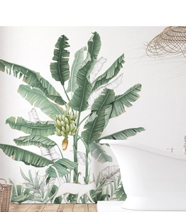 Detail of banana leaf wall stickers with a white cat silhouette in a modern bathroom