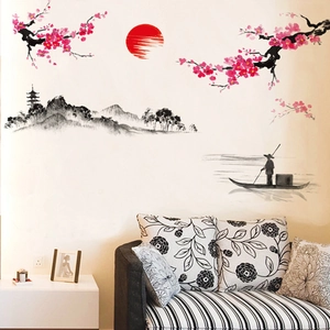 Sticker mural style encre chinoise avec prunier, soleil rouge et montagnes sur canapé