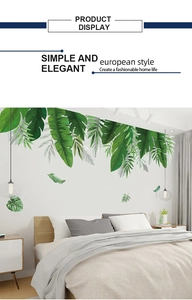 Detail showing tropical banana leaf wall stickers in a modern minimalist bedroom setting