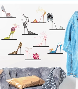 Fashionable high heel wall decals displayed above a velvet sofa in a modern living room