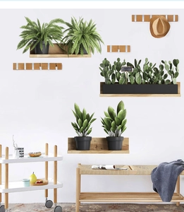 Detail view of Scandinavian wooden folding wall hooks and minimalist plant shelves