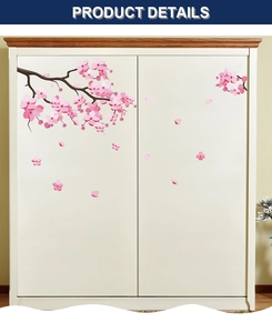 Detail of cherry blossom wall stickers on a white closet showing pink flower decals