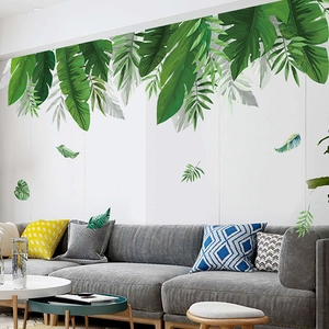 Tropical green plant wall decals featuring palm leaves and monstera for living room decor