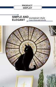Detail view of round black cat wall sticker with colorful stained glass dome patterns