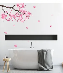 Detailed view of pink cherry blossom wall decals applied on a modern bathroom wall