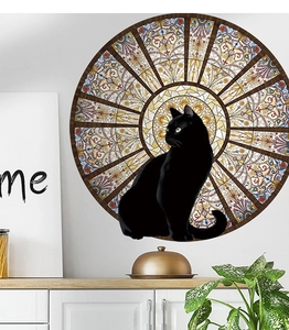 Detail of round wall sticker with black cat silhouette and stained glass patterns